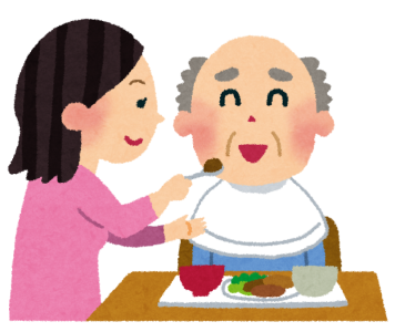 食事を介助している女性のイラスト